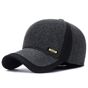 Close-up of the grey winter baseball cap with classic gold logo and ear protection detail