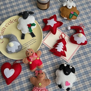Detailed view of handmade felt Christmas ornaments like gnomes and gingerbread men