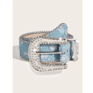 Detail of vintage denim belt with large rhinestone buckle and distressed hole design
