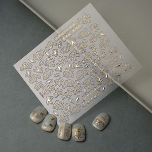 Detail of 5D gold embossed bamboo and bird nail art stickers with Chinese calligraphy