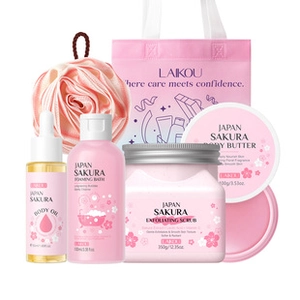 Detailed set of Sakura body care products including scrub, lotion, oil, and a pink gift bag