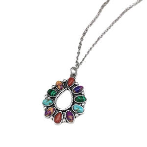 Bohemian silver necklace featuring a teardrop pendant with colorful turquoise stones