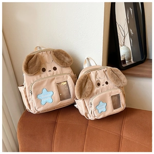Detailed comparison of two sizes of cute puppy cartoon backpacks for kids in apricot