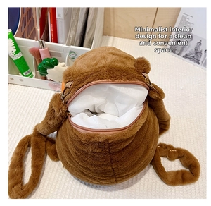 Macro view of plush Capybara backpack interior showing brown zip and white lining