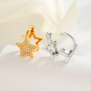 Star-shaped earrings with micro-paved zircons in gold and silver finish on stone base