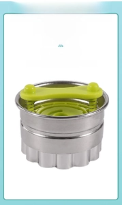 Detail of 430 stainless steel cookie mold with green PP handle and spring mechanism