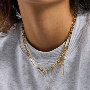 Gold stainless steel paperclip necklace with pearls, heart charms, and a cross pendant
