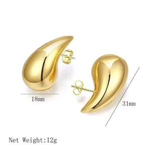 Polished 18K gold teardrop earrings in irregular hollow design measuring 31mm by 18mm