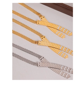 Detail of cross-cut titanium steel necklaces with wave-patterned crystal diamond inlay