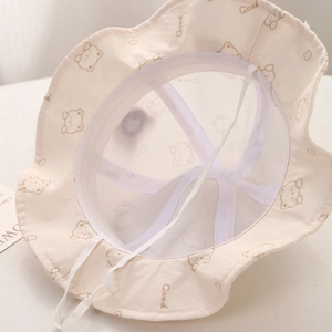Close-up of baby sun hat showing breathable mesh lining and adjustable windproof cord