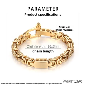 Close-up of gold stainless steel Byzantine chain bracelet with U-shaped buckle clasp detail