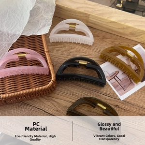 Detail of high-quality PC material hair claws with durable metal spring and glossy finish