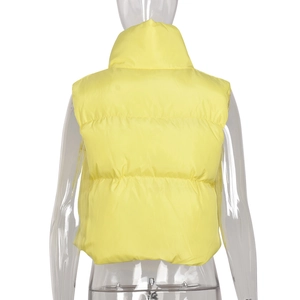 Rear view of bright yellow quilted puffer vest with high stand collar and layered panels