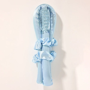 Heatless hair curler set with light blue silk ribbon, matching scrunchies and clear claw clip
