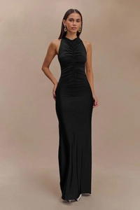 Detail of ruched texture and slim fit design on black sleeveless halter maxi dress