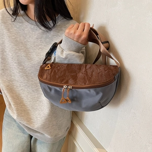 Contrast color dumpling chest bag with brown and blue nylon panels for sports