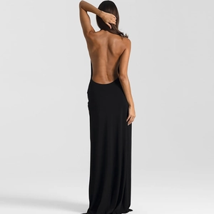 Detail view of backless design and halter neck on elegant black floor-length dress