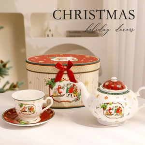 Ceramic Christmas tea set with teapot and cups in a festive gift box for holiday home decor