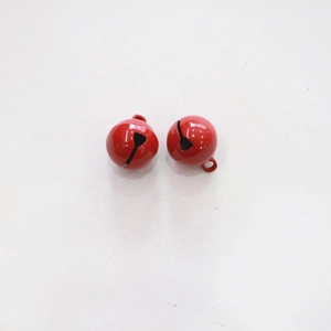 Close-up of two small 14mm vibrant red metal bells with a polished lacquer finish