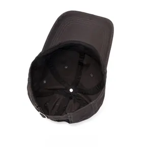 Detailed internal view of cotton baseball cap showing stitching and ventilation eyelets