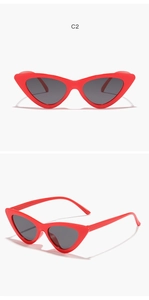 Close-up of red cat eye sunglasses with gray lenses shown from front and side angles