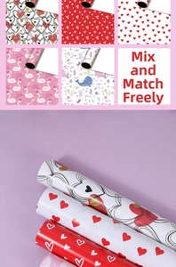 Detail view of assorted heart and swan pattern wrapping paper rolls for gift packaging