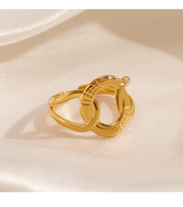 Detail of 18K gold plated stainless steel ring with textured crisscross double band design
