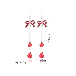 Detail of red bow bell earrings with dimensions 6.39cm height and 1.52cm width