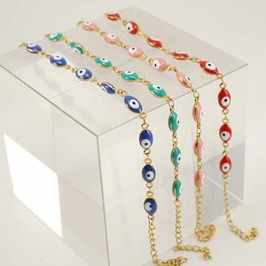 Evil eye stainless steel bracelets in blue, green, pink, and red with 18K gold finish