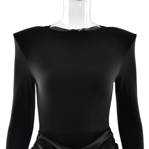 Detail of black long sleeve dress featuring padded shoulders and ruched waist texture