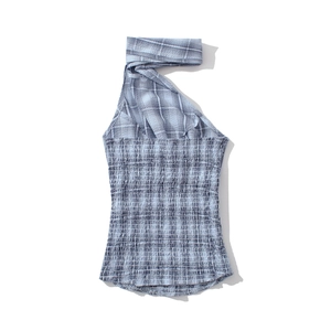 Detail of blue and white checkered halter top with elastic pleated fabric texture
