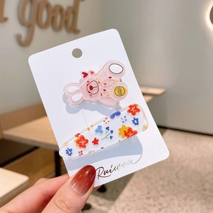 Cute acrylic hair clips set featuring pink bunny and floral patterns on card