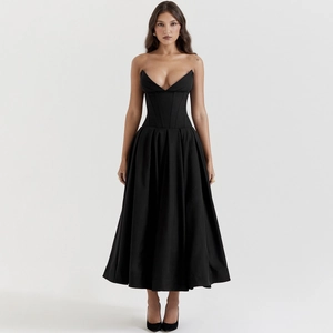 Detailed view of the fishbone corset waist and backless design on black tube maxi dress