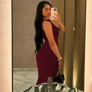 Close-up of sleeveless slim-fit dark red dress showing the high-stretch premium fabric