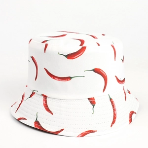 Close-up of white cotton bucket hat with vibrant red chili pepper pattern and fine stitching