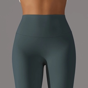Détail du legging de yoga sans couture à taille haute en bleu sarcelle avec gaine ventrale