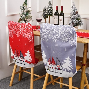 Christmas chair covers featuring festive gnomes and snowflakes in red and grey colors