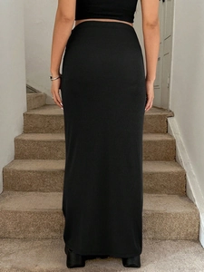 Rear view of black ribbed knit maternity maxi skirt with adjustable high waist band