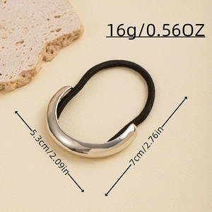 Detailed view of gold metallic hair tie with size specifications 5.3cm and 7cm