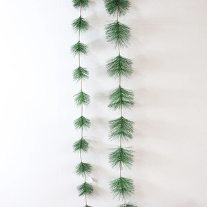Artificial pine needles garland for Christmas tree decoration and festive hanging ornaments