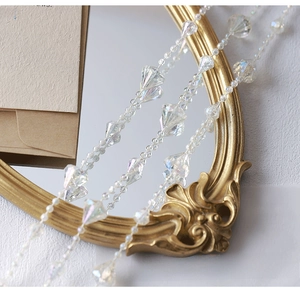 Macro detail of crystal beads and pearls on a gold frame for DIY jewelry making