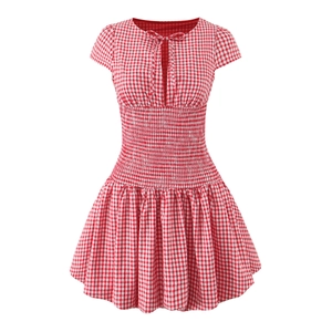 Detail of red and white plaid dress showing smocked waist and tie neckline