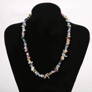 Detail of bohemian handmade necklace with colorful natural irregular crystal stone beads