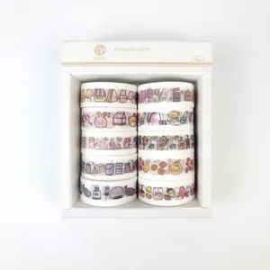 Detail view of 10 rolls of floral washi tape with fruit and dessert patterns in white box