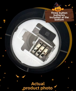 Detail of the LED pumpkin lantern base showing the AG13 battery compartment and power switch
