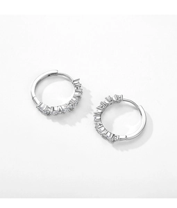 Macro shot of silver S925 sterling silver hoop earrings set with sparkling zircon stones