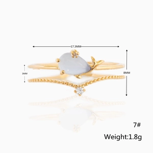 Detail view of two gold whale rings with size 7 dimensions and 1.8g weight specs