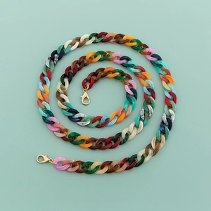 Macro shot of 120cm colorful mixed acrylic chain links with golden lobster clasps