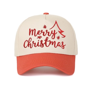 Close-up of Merry Christmas embroidery on a beige and red five-panel trucker hat