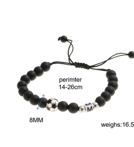 Detail view of black matte beaded bracelet with silver soccer charm and letter M cubes